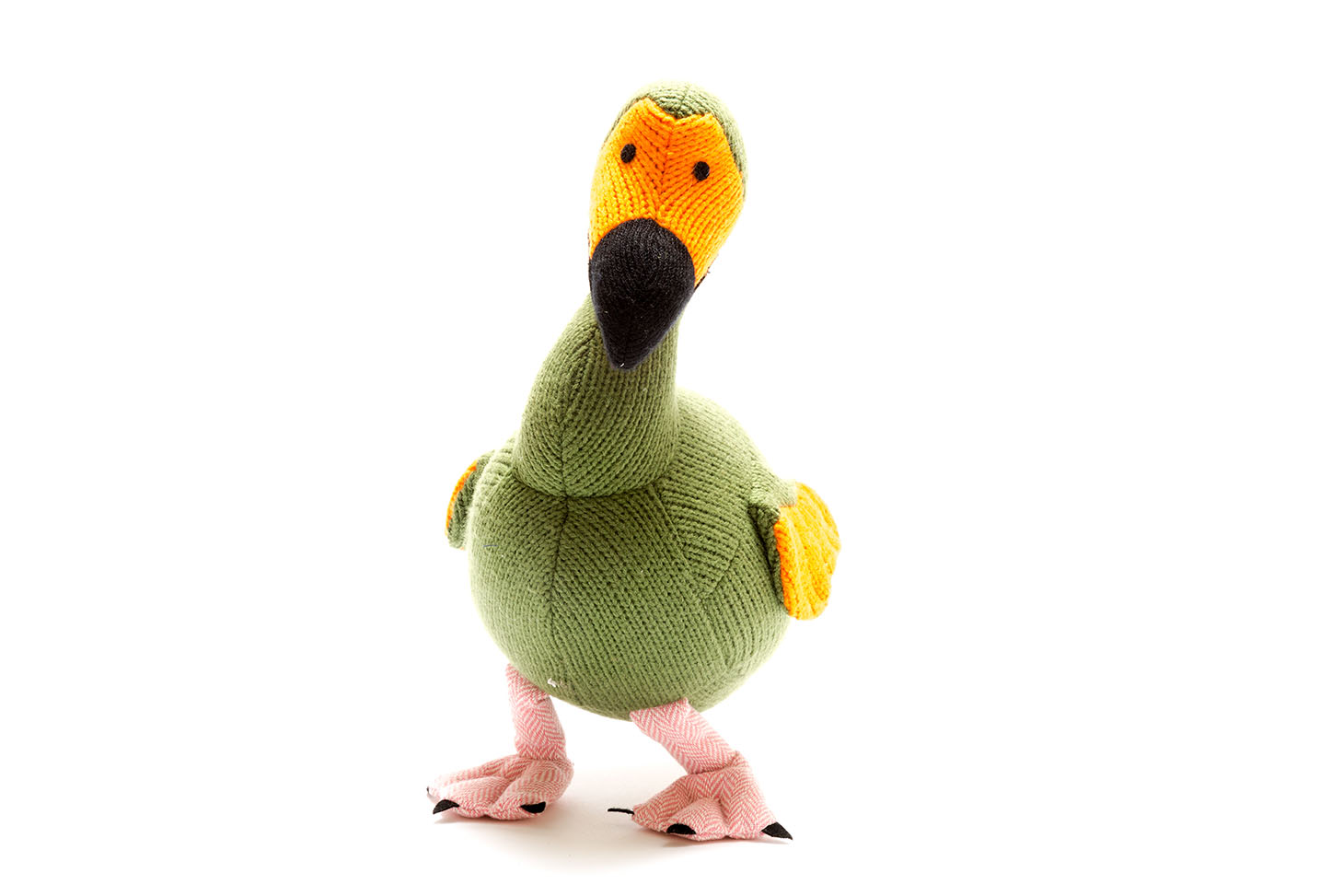 Knitted moss green dodo soft toy with painting of dinosaurs behind